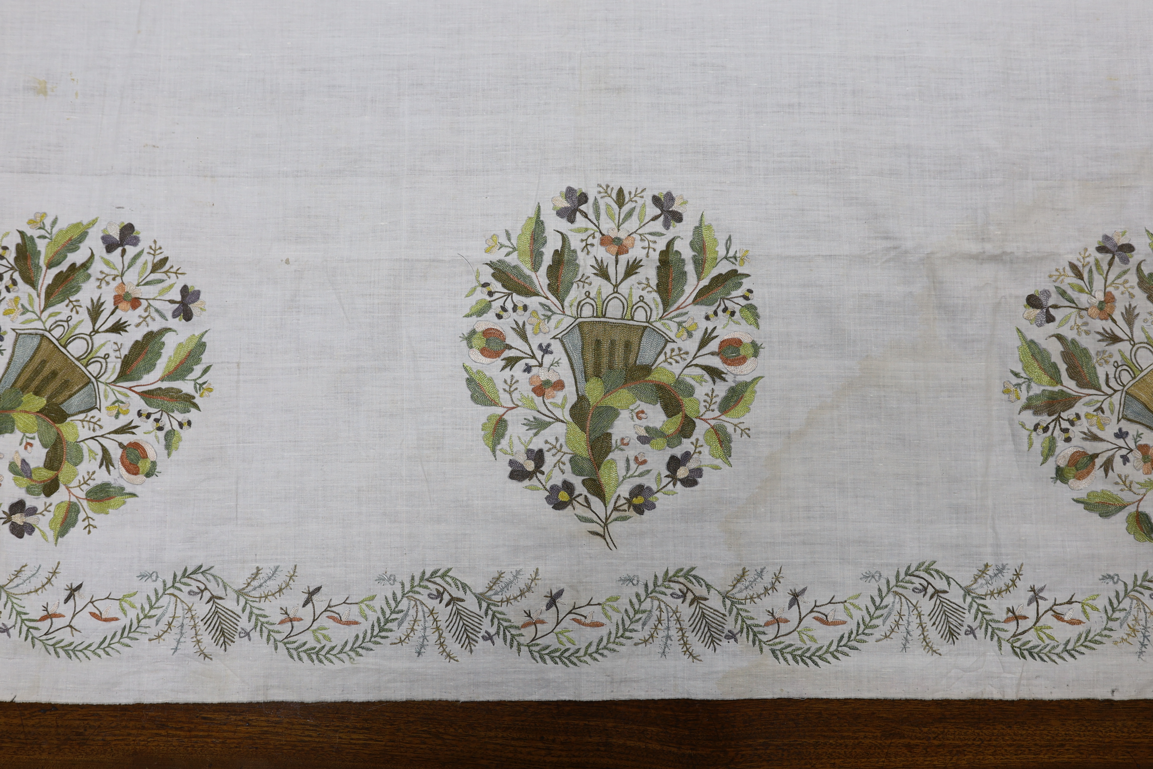 A late 18th-19th century fine linen chain stitched floral embroidered panel, possibly Kashmiri, using traditional design elements and embroidery similar from earlier embroideries of this kind worked on narrower looms, 22